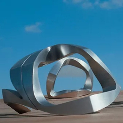 L'estratto del metallo del giardino moderno avvolge le sculture di acciaio inossidabile per all'aperto