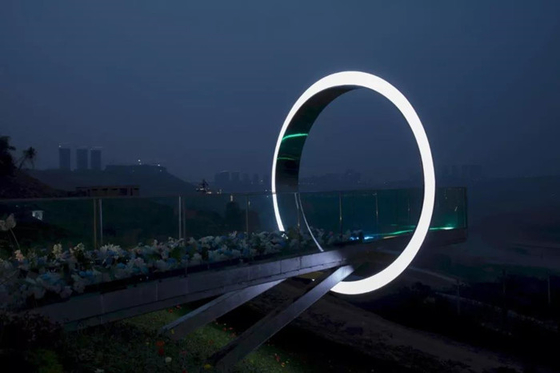 Le sculture all'aperto del giardino del portone della luna del cerchio hanno lucidato inossidabile su misura